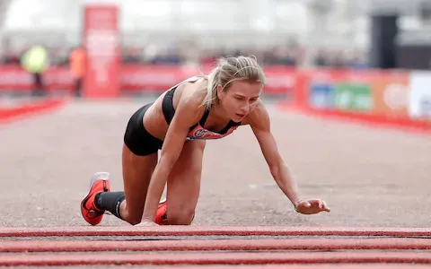 Hayley collapses and crawls across the finish line, She knew where to put the tired click here to see the amazing video